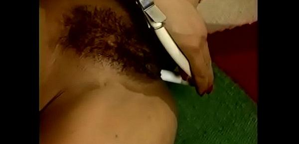  Brunette fucker Pam Dee rubs her clitoris while inserting an apparatus up her ass